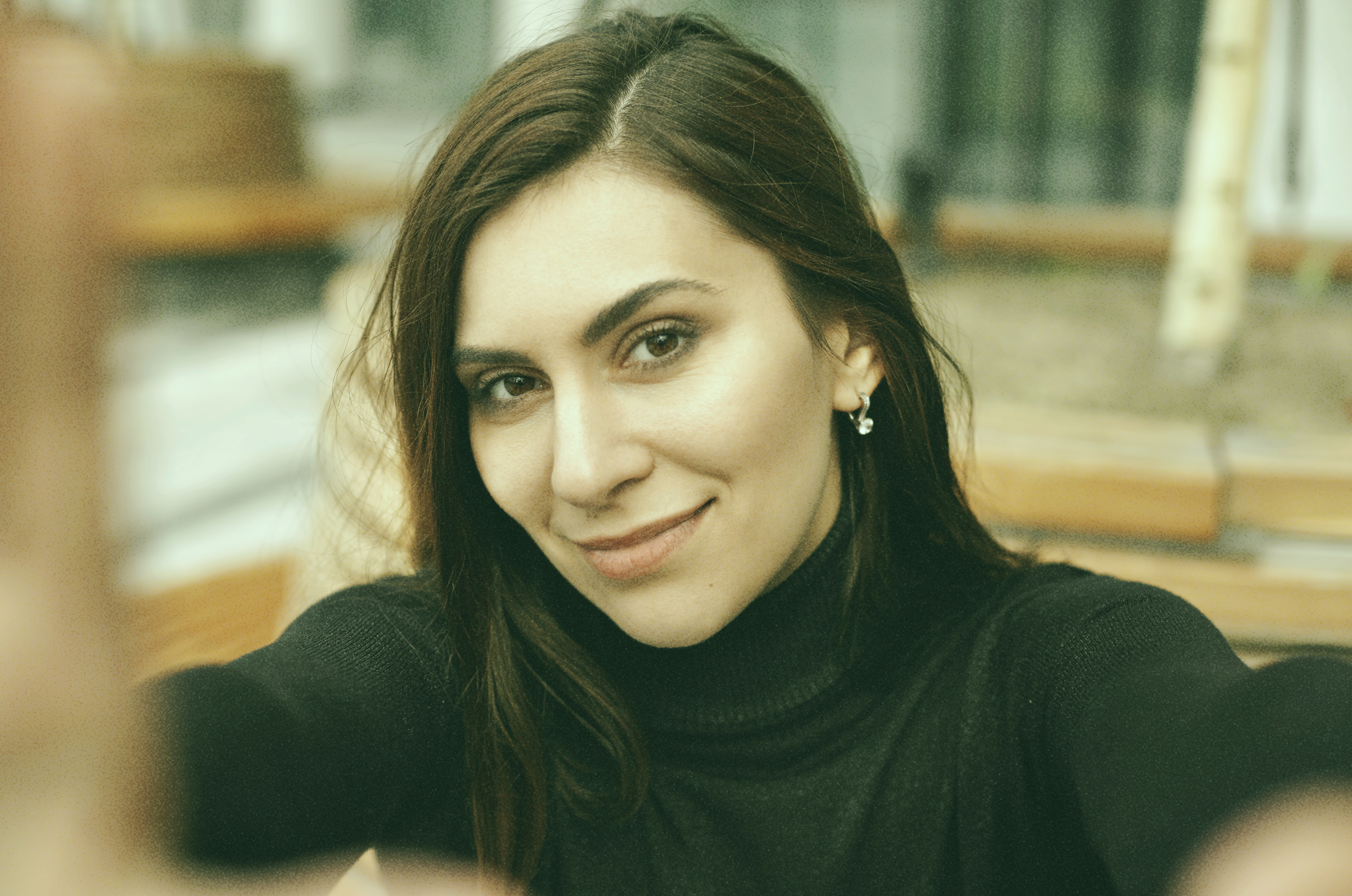 pretty young brunette female taking selfie